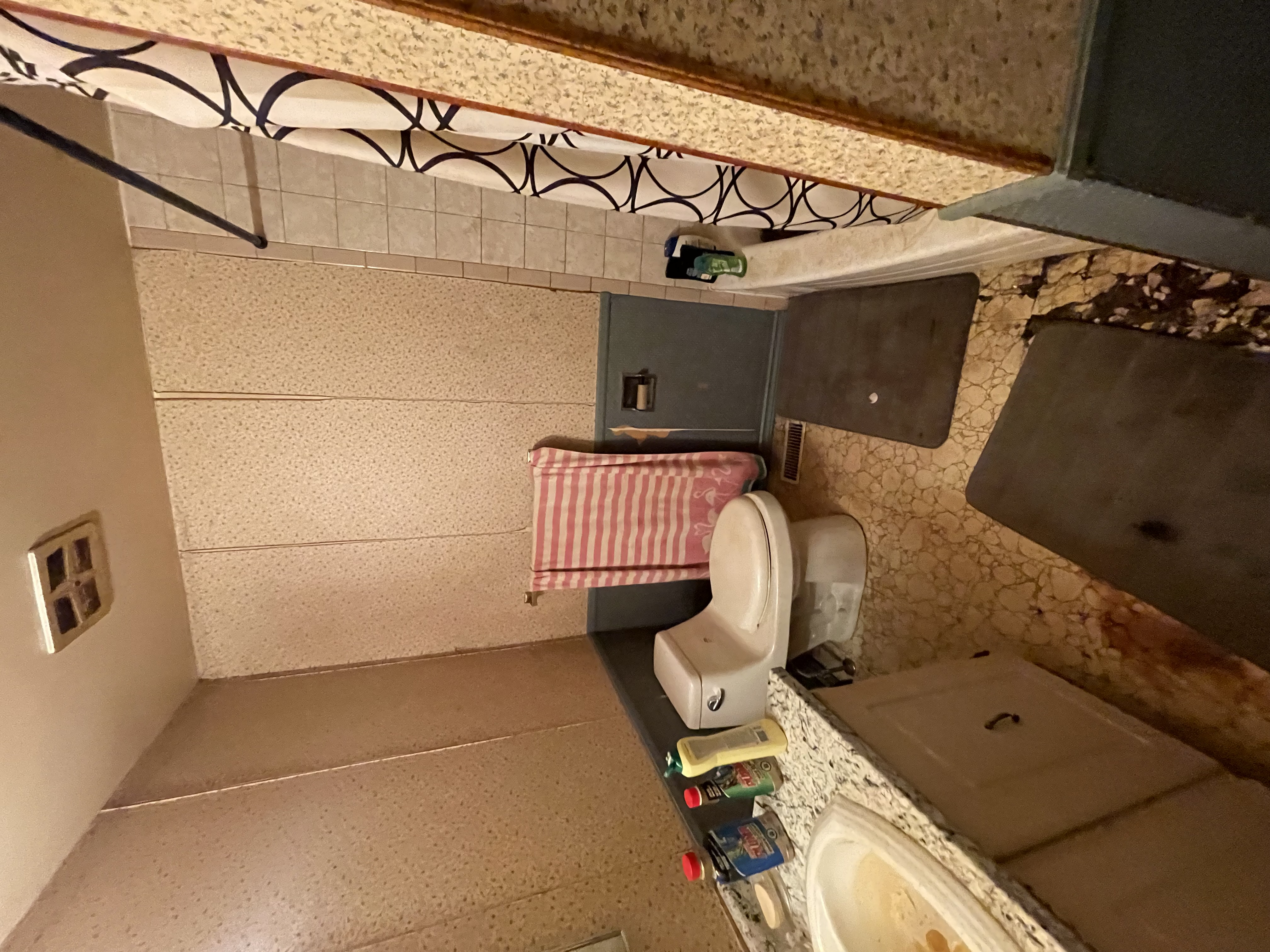 Dated bathroom with beige tile and worn finishes clearly documents pre-renovation state — excellent before/after storytelling potential — Gateshead, Hamilton | MTC Renovations