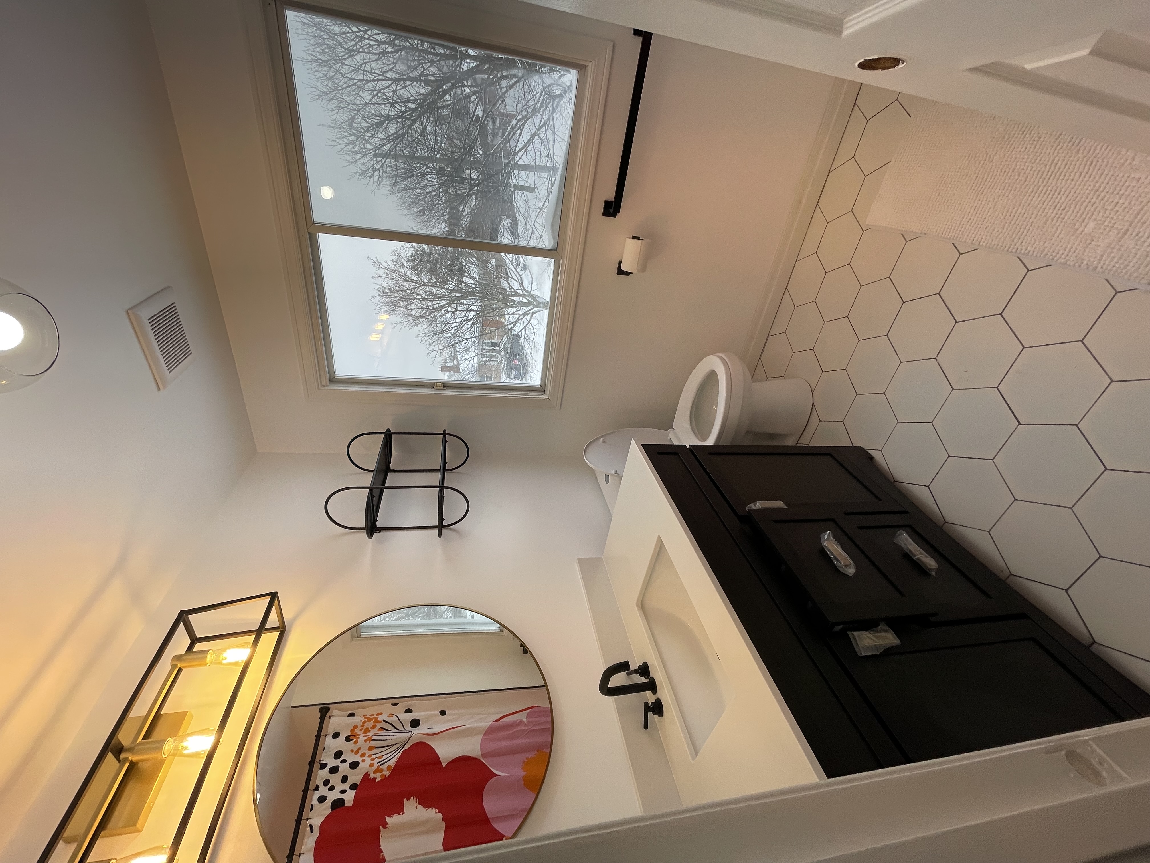 Bright finished bathroom with modern fixtures, hexagon tile, and strong natural light — excellent portfolio shot — Buchanan, Hamilton | MTC Renovations
