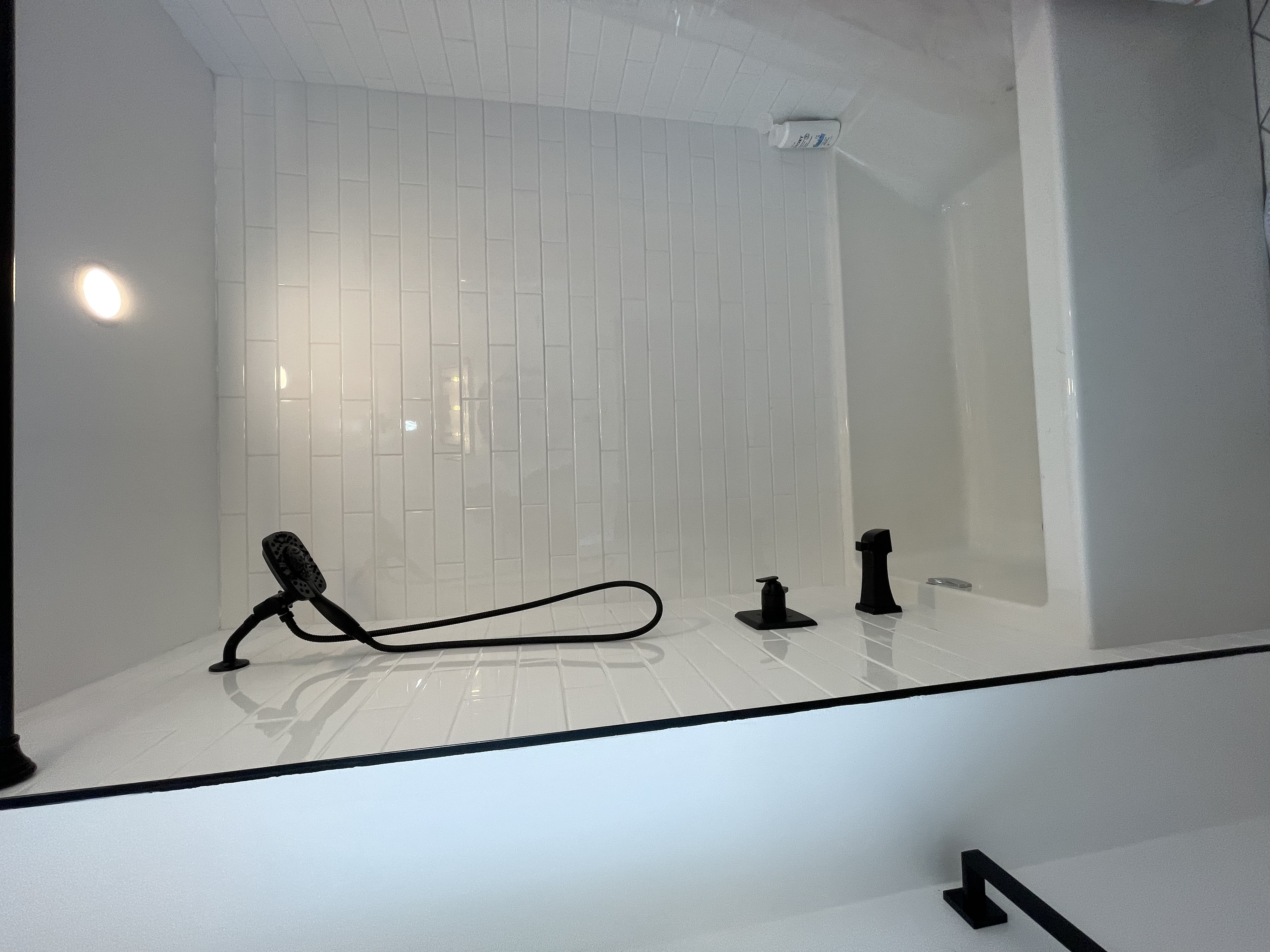 Clean finished bathroom with classic white subway tile and modern black fixtures — strong portfolio piece — Buchanan, Hamilton | MTC Renovations