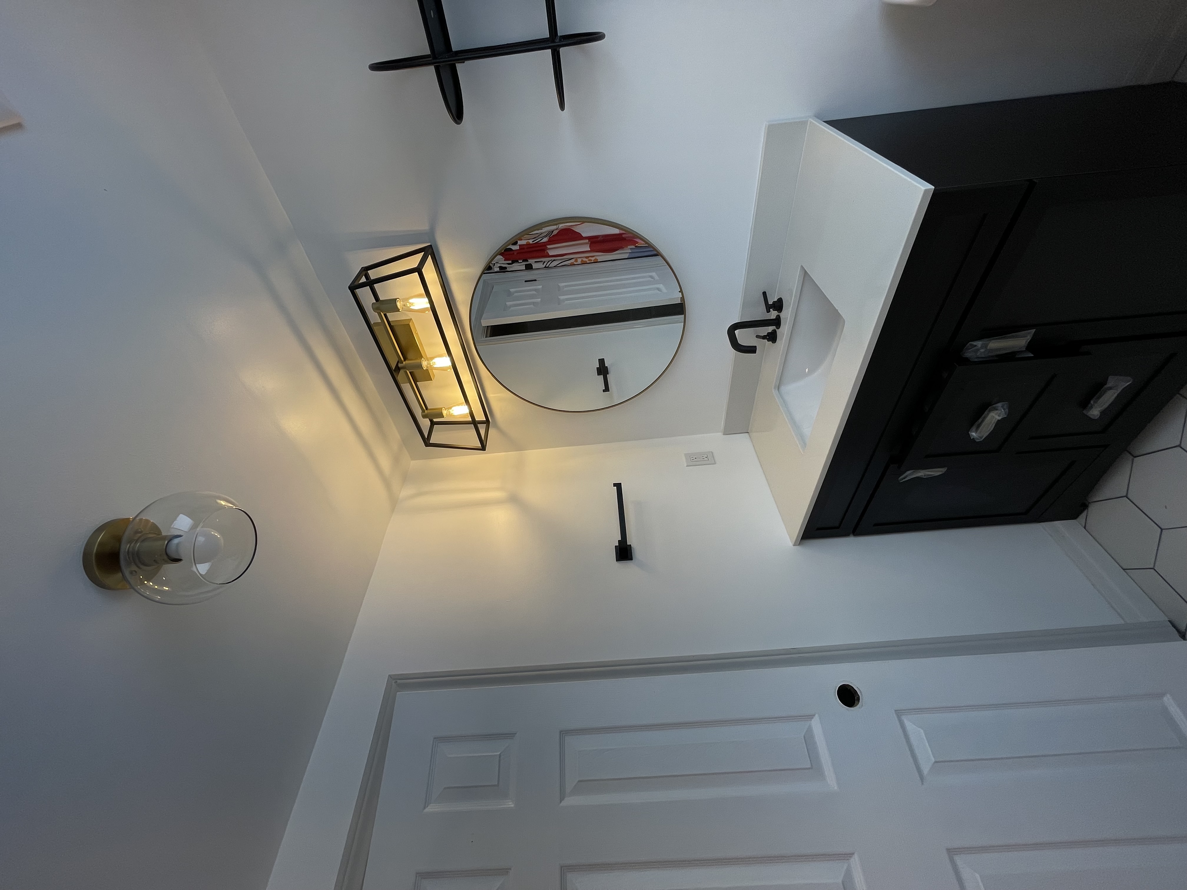 Clean finished bathroom with modern fixtures and good lighting showing complete renovation quality — Buchanan, Hamilton | MTC Renovations