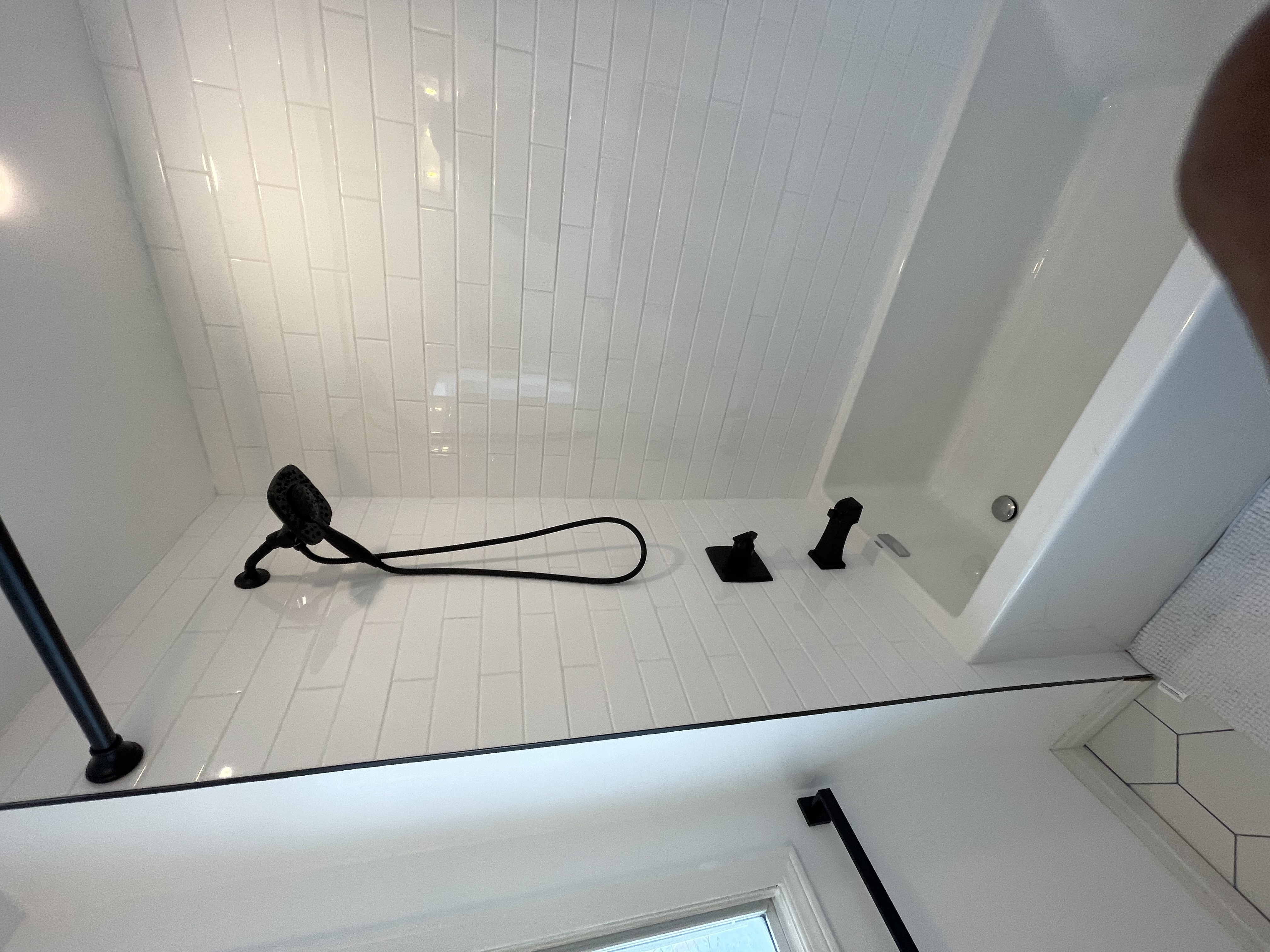 Clean finished bathroom with classic white subway tile and black fixtures — strong portfolio shot with timeless appeal — Buchanan, Hamilton | MTC Renovations