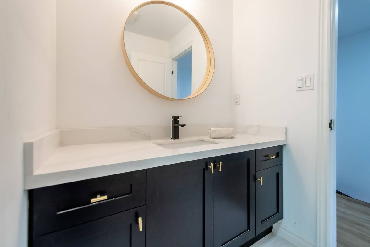 Bright finished bathroom with strong material contrast and clean staging — premium portfolio shot — Stonehenge, Hamilton | MTC Renovations