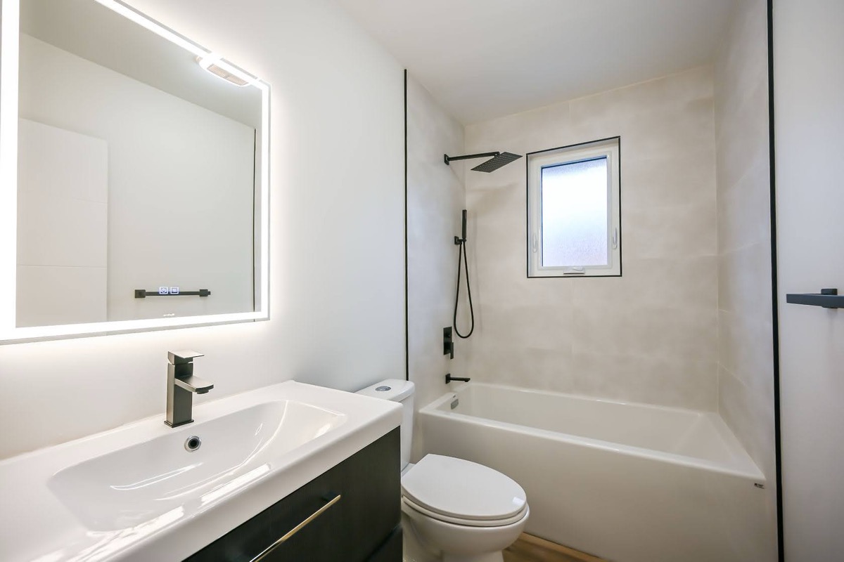Clean modern bathroom with excellent lighting and professional staging — premium portfolio shot with strong virtual tour quality — Winchester, Hamilton | MTC Renovations