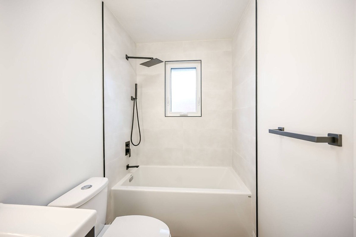 Clean modern bathroom with excellent natural light and professional wide-angle composition — premium portfolio shot — Winchester, Hamilton | MTC Renovations