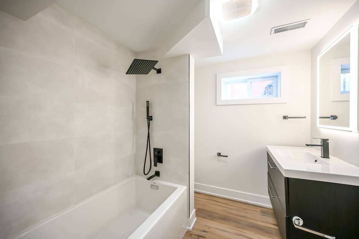 Clean modern bathroom with excellent natural light and professional wide-angle composition — strong portfolio piece — Winchester, Hamilton | MTC Renovations