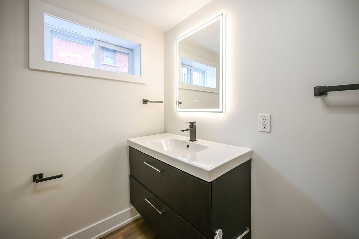 Clean modern bathroom with excellent natural light and professional staging — strong portfolio piece — Winchester, Hamilton | MTC Renovations