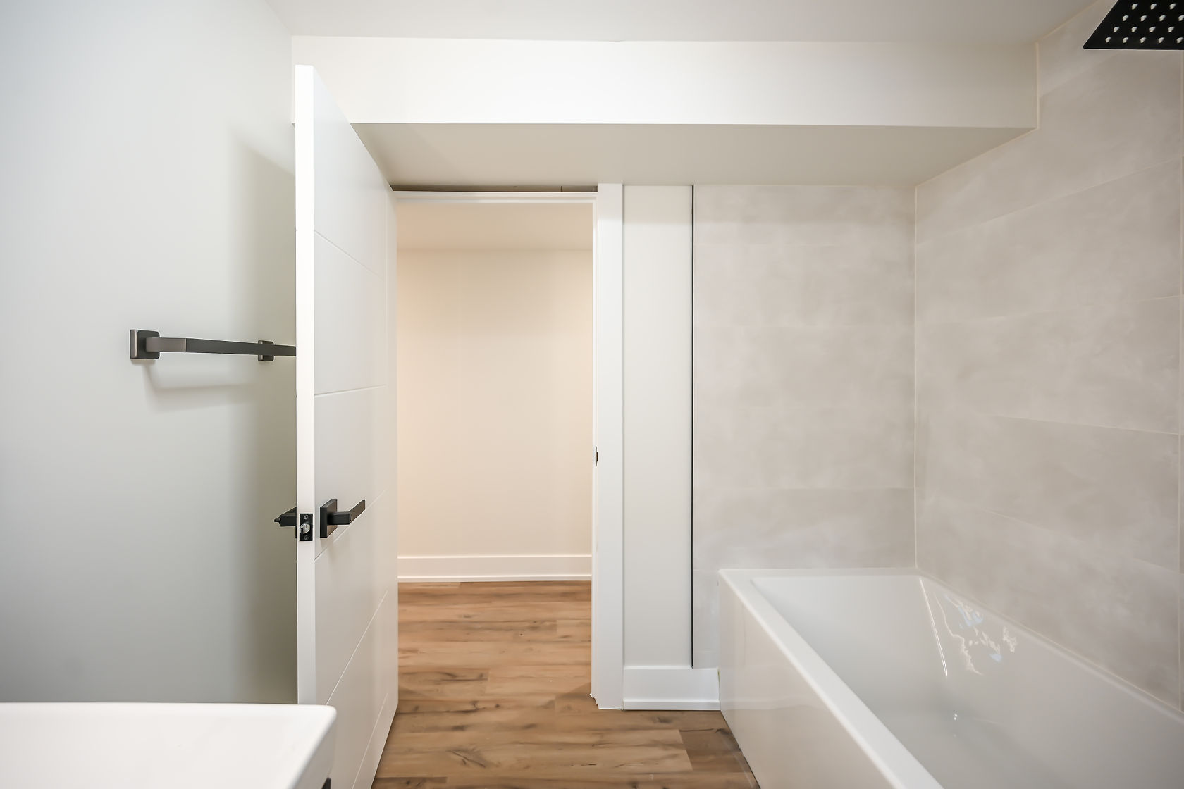 Clean modern bathroom with excellent wide-angle composition showing full space — strong portfolio piece — Winchester, Hamilton | MTC Renovations