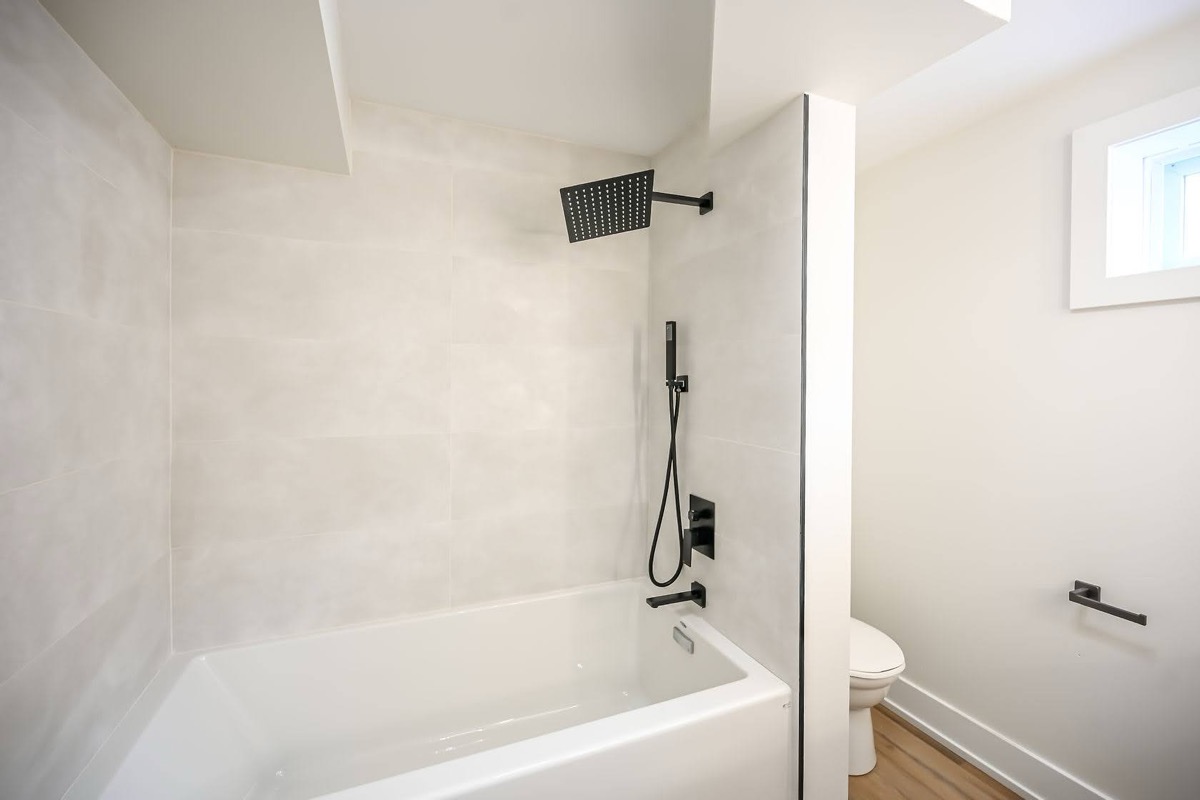 Clean modern bathroom with excellent natural light and professional wide-angle composition — strong portfolio piece — Winchester, Hamilton | MTC Renovations
