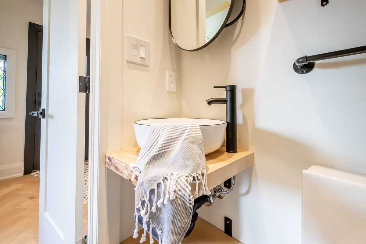 Beautifully staged modern powder room with vessel sink and warm wood vanity — premium portfolio shot — Rosedene, Hamilton | MTC Renovations