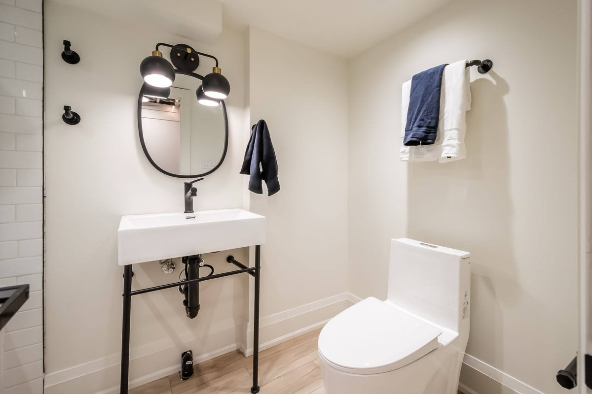 Modern finished bathroom with industrial vanity and clean staging — premium portfolio shot with strong design appeal — Rosedene, Hamilton | MTC Renovations