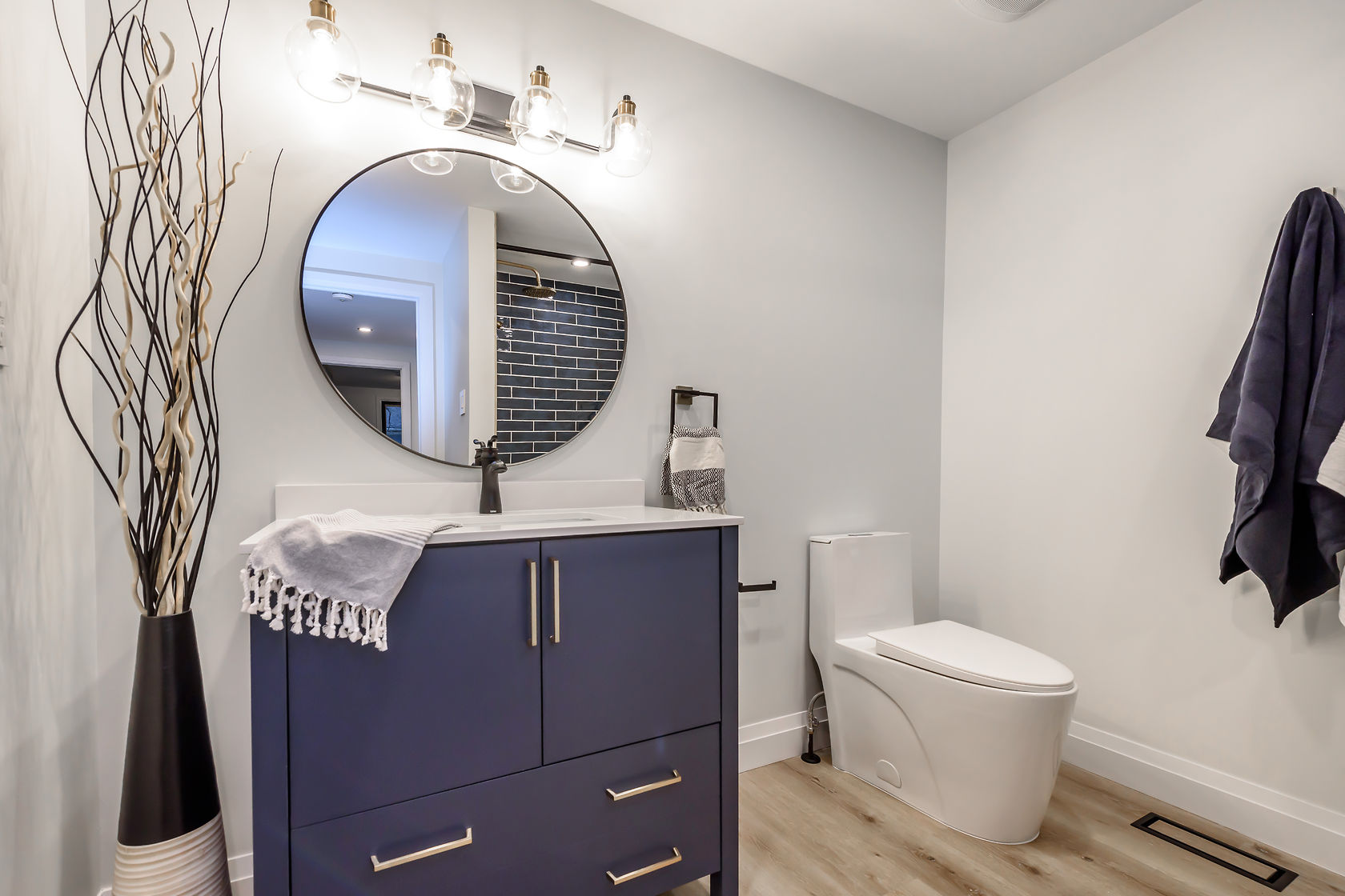 Beautifully finished powder room with strong design elements and professional staging — premium portfolio shot — Gateshead, Hamilton | MTC Renovations