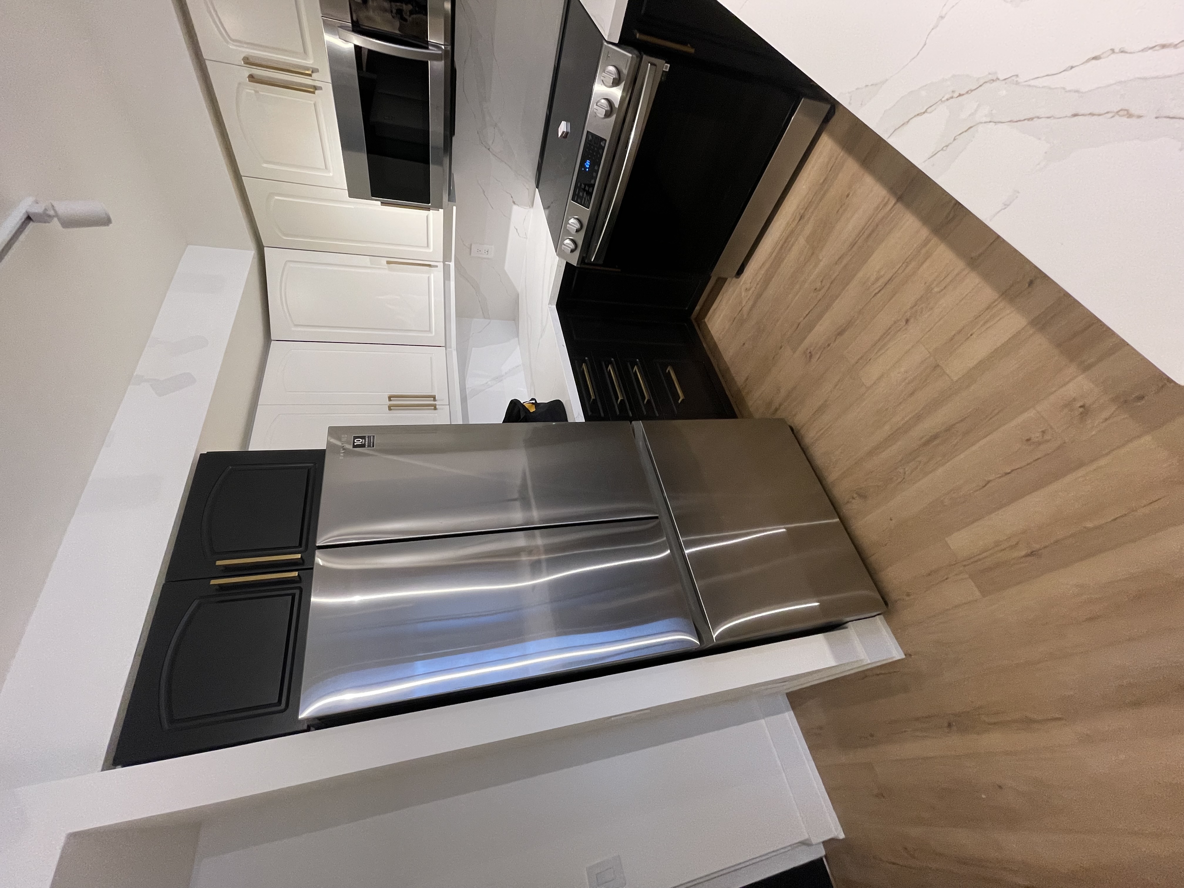 Modern two-tone kitchen with strong dark/light contrast and clean finishes — excellent portfolio shot — Queensway, Hamilton | MTC Renovations