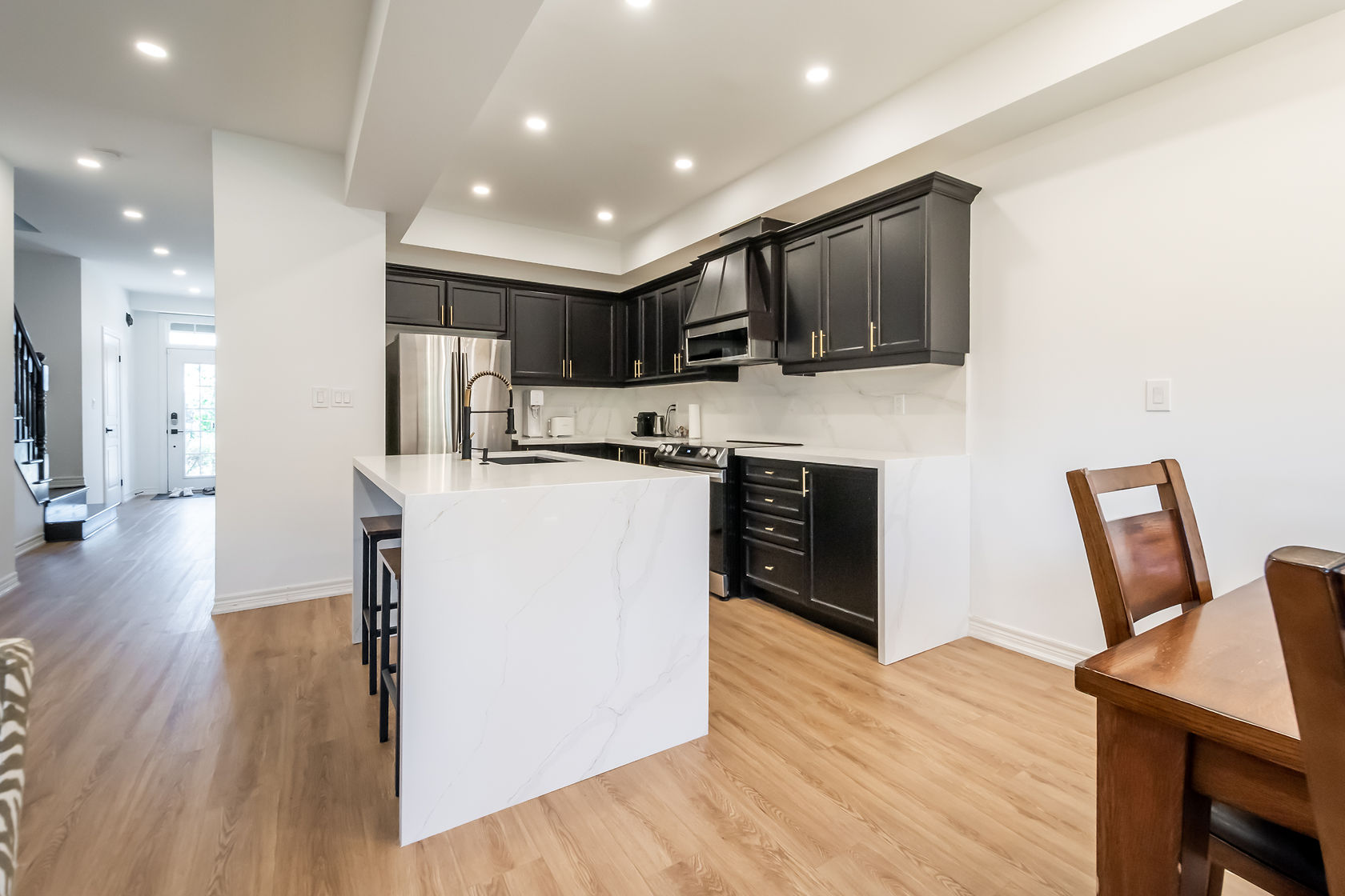 Professional wide-angle finished kitchen with excellent material contrast and clean staging — premium portfolio shot — Stonehenge, Hamilton | MTC Renovations