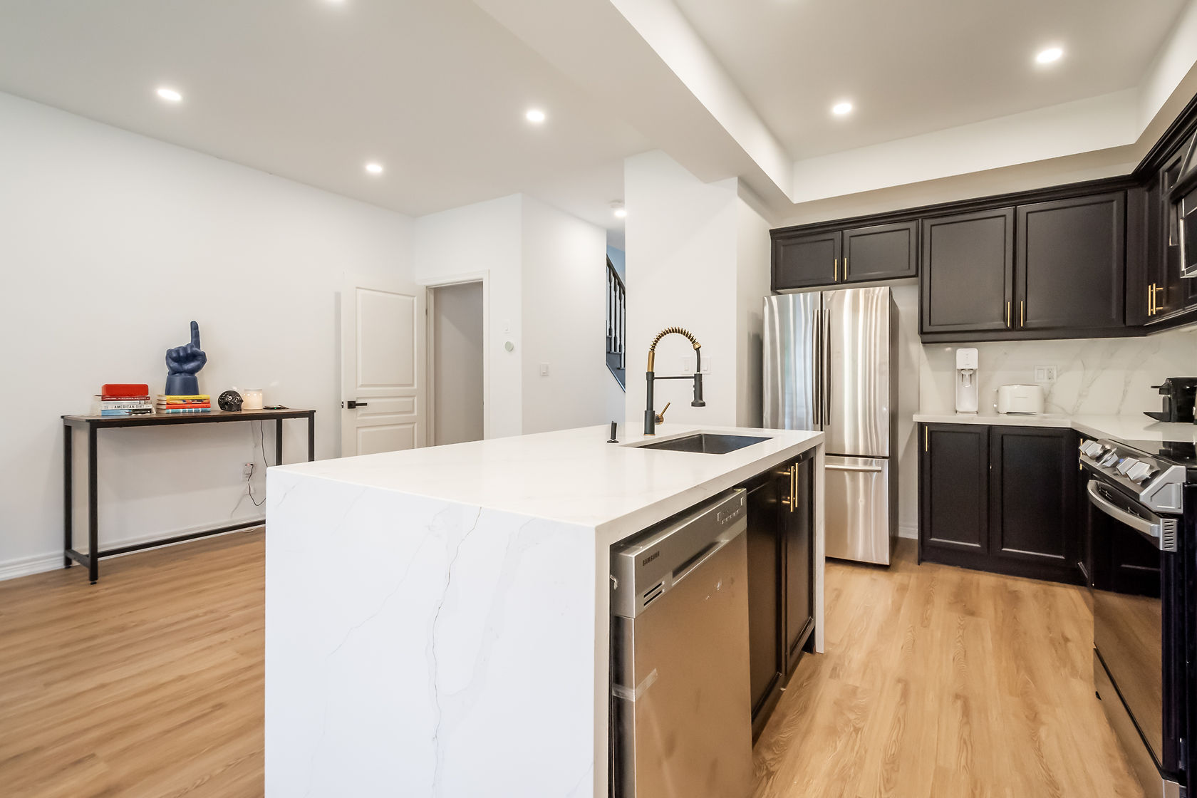 Professional wide-angle finished kitchen with excellent material contrast and clean staging — premium portfolio shot — Stonehenge, Hamilton | MTC Renovations