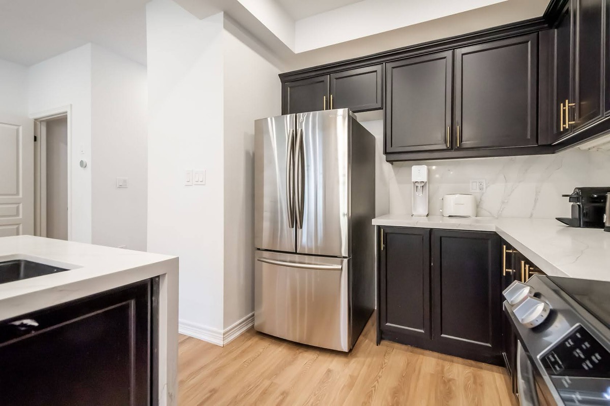 Professional wide-angle finished kitchen with excellent material contrast and clean staging — premium portfolio shot — Stonehenge, Hamilton | MTC Renovations