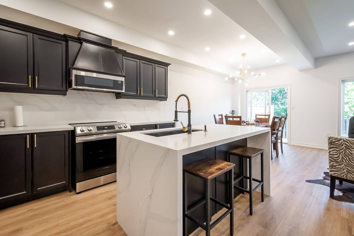 Premium finished kitchen with excellent material contrast and open-concept flow — Stonehenge, Hamilton | MTC Renovations