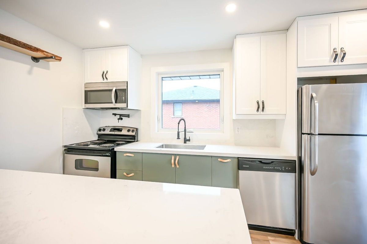 Bright finished kitchen with strong two-tone cabinet contrast and clean staging — premium portfolio shot — Winchester, Hamilton | MTC Renovations