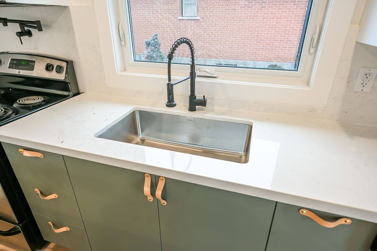 Clean finished kitchen with trendy sage cabinets, white quartz counters, and excellent natural light — strong portfolio piece — Winchester, Hamilton | MTC Renovations