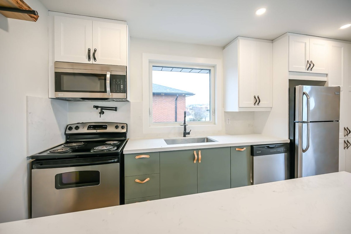 Bright finished kitchen with strong two-tone cabinet contrast and clean staging — premium portfolio shot — Winchester, Hamilton | MTC Renovations