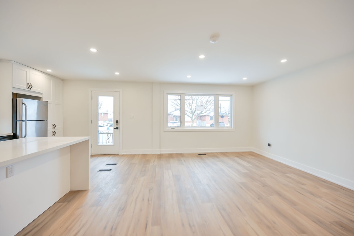 Bright open-concept kitchen with excellent natural light and clean modern finishes — premium portfolio shot — Winchester, Hamilton | MTC Renovations