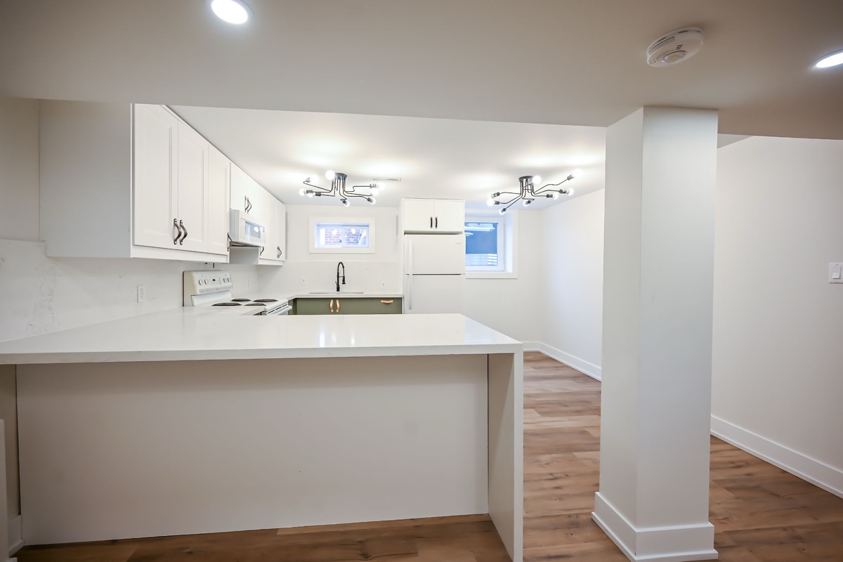 Clean finished kitchen with wide-angle view showing full layout — excellent multi-channel marketing value — Winchester, Hamilton | MTC Renovations