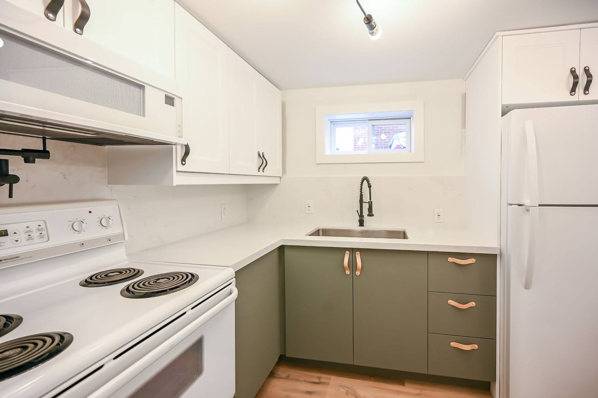 Clean finished kitchen with strong two-tone cabinet contrast and good natural lighting — solid portfolio piece — Winchester, Hamilton | MTC Renovations