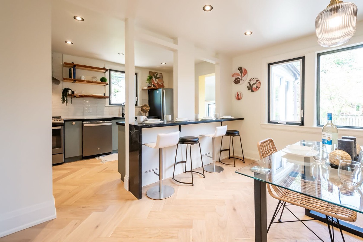 Bright modern kitchen with excellent natural light, clean staging, and strong material contrast — premium portfolio shot — Rosedene, Hamilton | MTC Renovations
