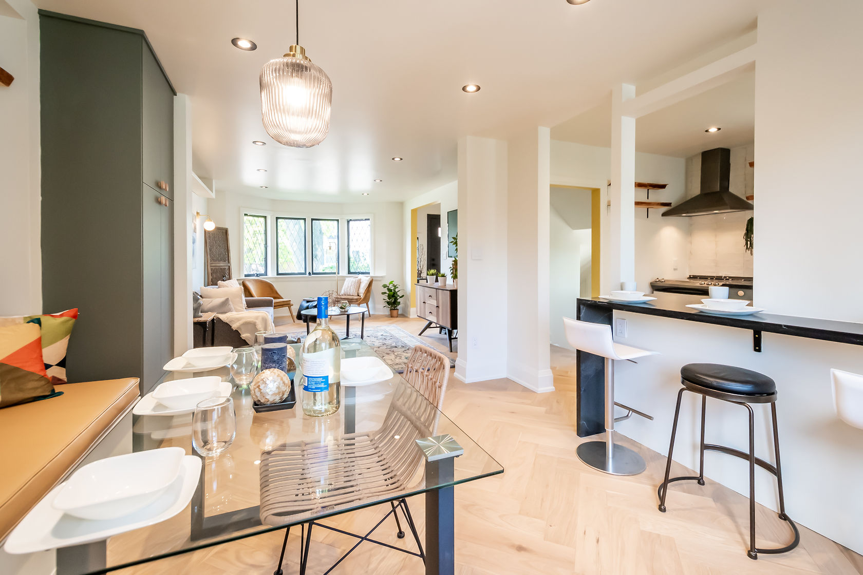 Premium open-concept kitchen with excellent natural light, professional staging, and strong material contrast — Rosedene, Hamilton | MTC Renovations