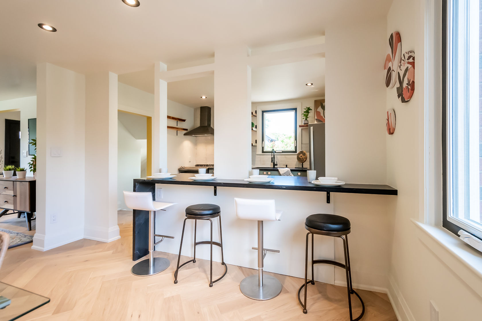 Bright modern kitchen with excellent natural light, clean staging, and strong material contrast — premium portfolio shot — Rosedene, Hamilton | MTC Renovations