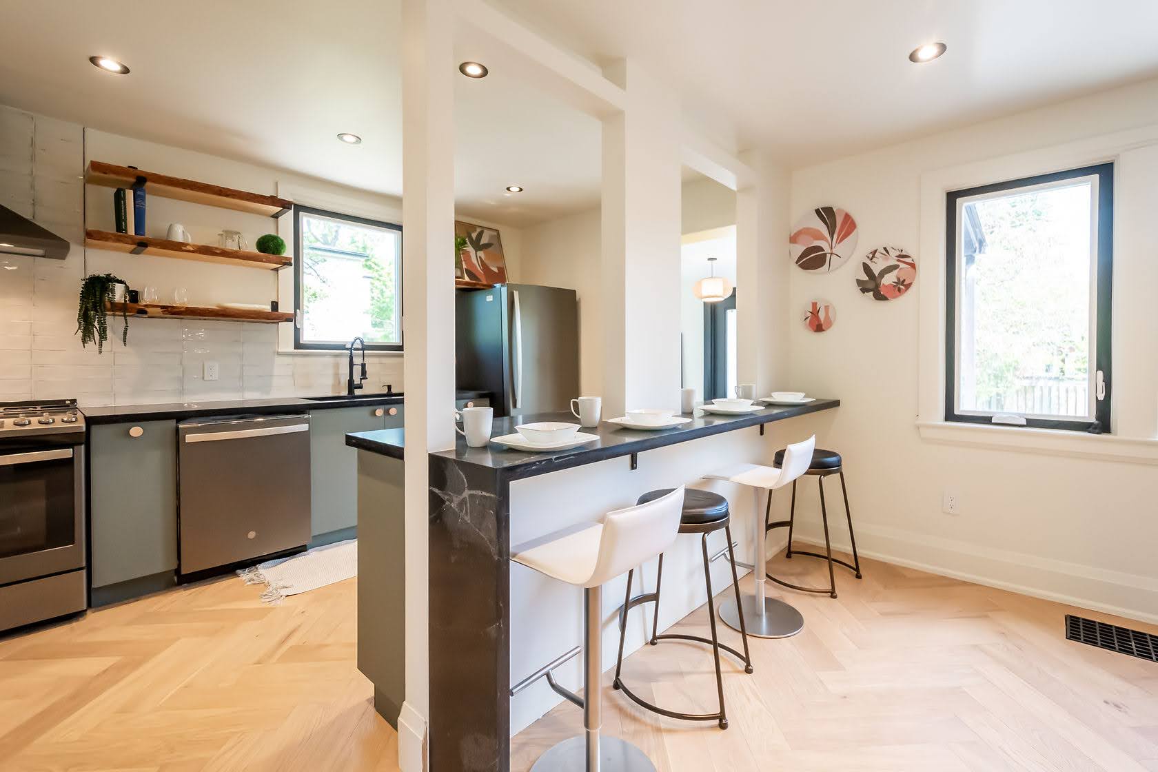Bright modern kitchen with excellent natural light, clean staging, and strong material contrast — premium portfolio shot — Rosedene, Hamilton | MTC Renovations
