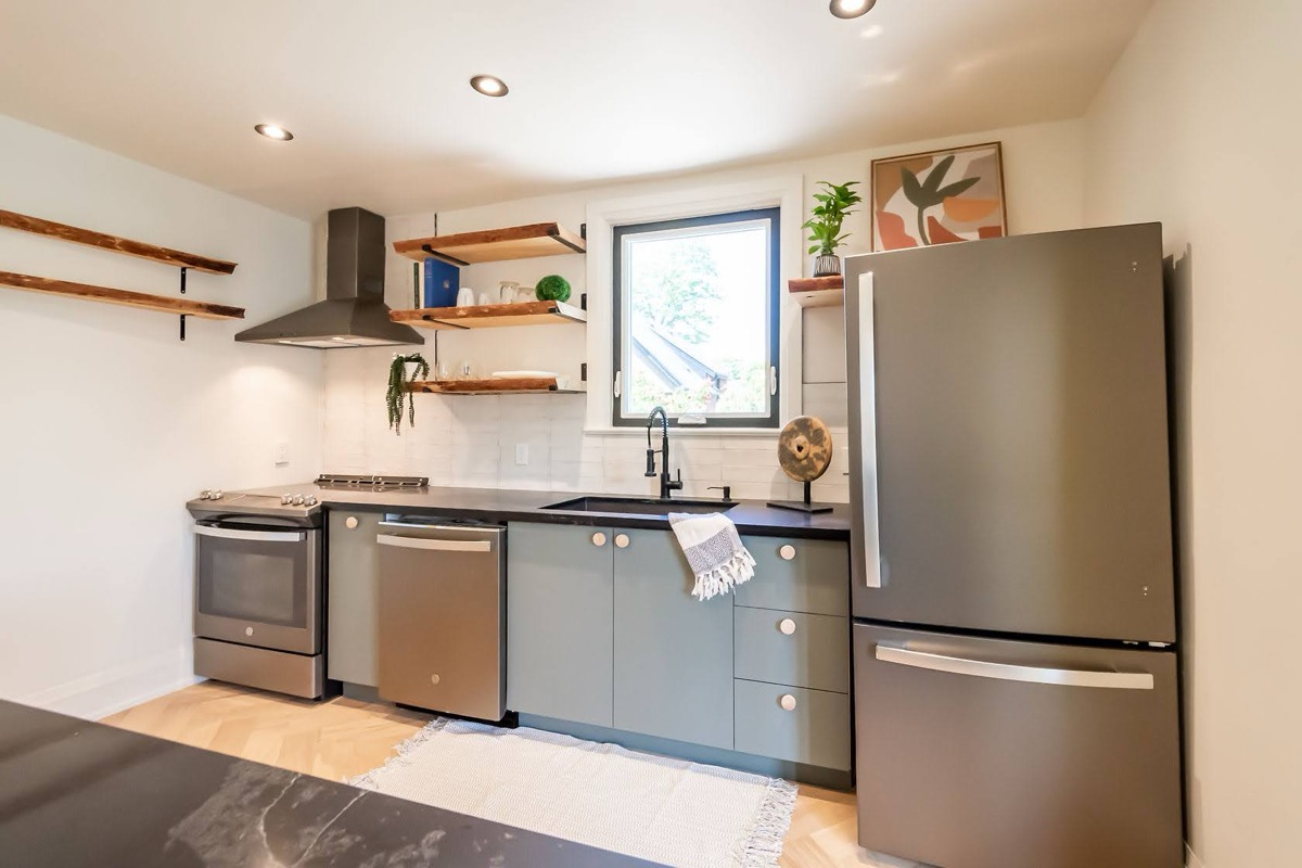 Bright modern kitchen with excellent natural light and clean staging — premium portfolio shot with strong material contrast — Rosedene, Hamilton | MTC Renovations