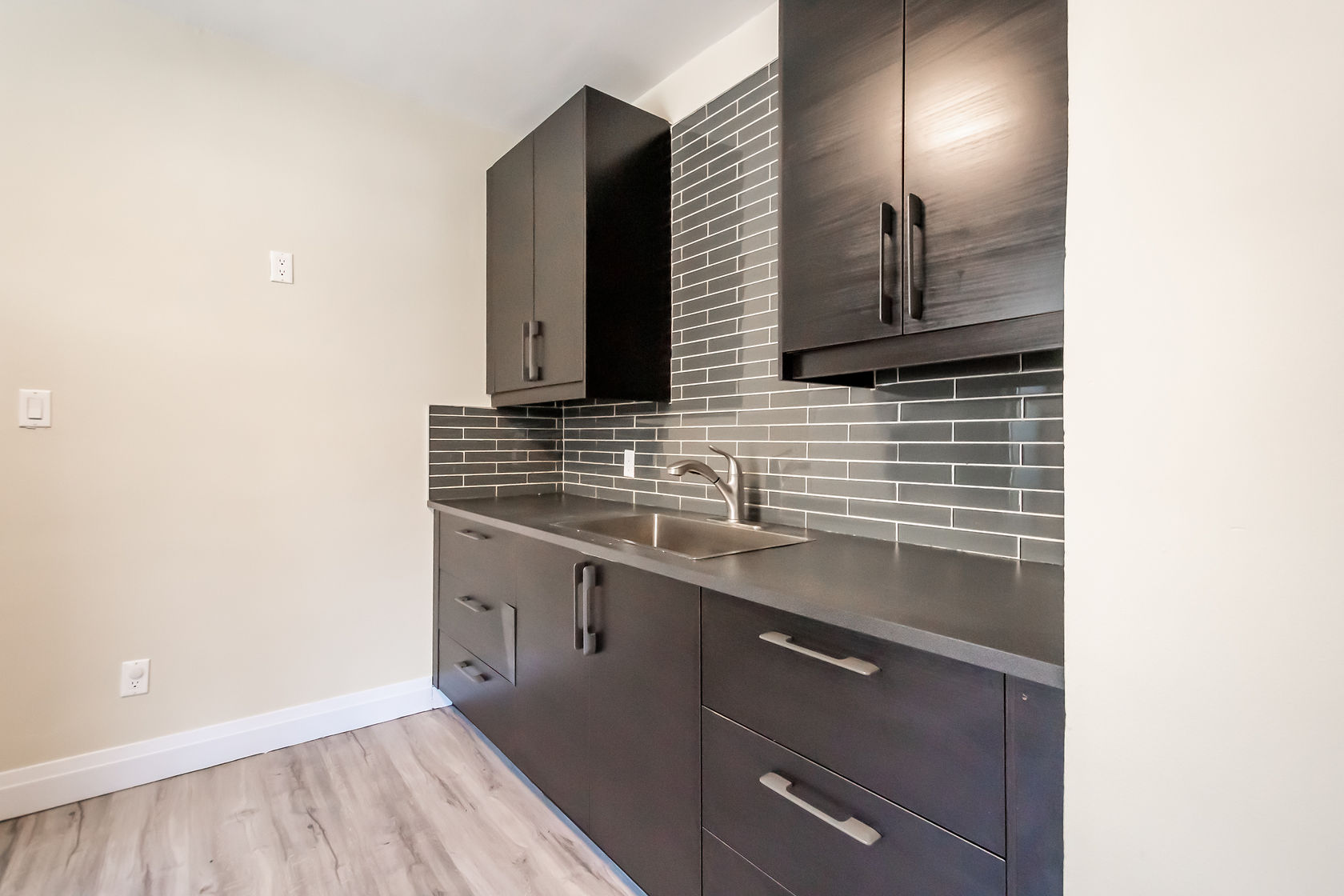 Clean finished kitchen with strong material contrast and professional staging — excellent portfolio shot — Eastchester, Hamilton | MTC Renovations