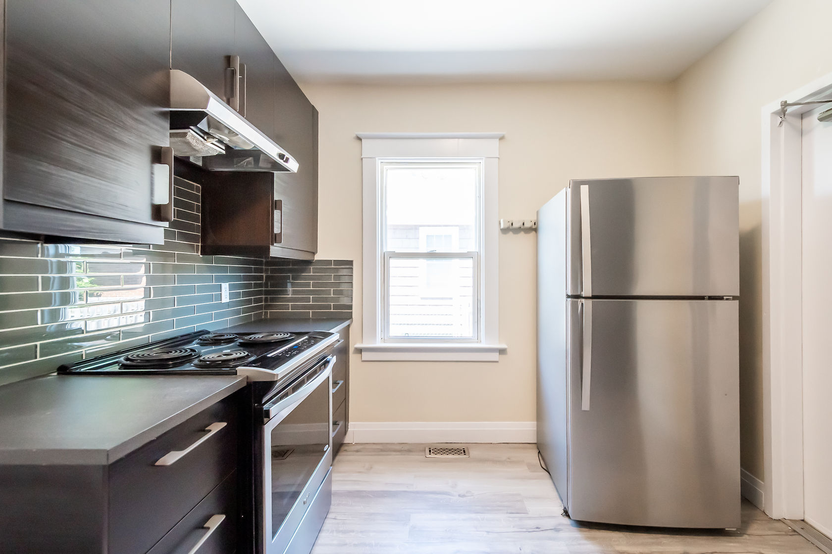 Clean finished kitchen with good natural light and modern finishes — strong portfolio shot for virtual tours and marketing — Eastchester, Hamilton | MTC Renovations