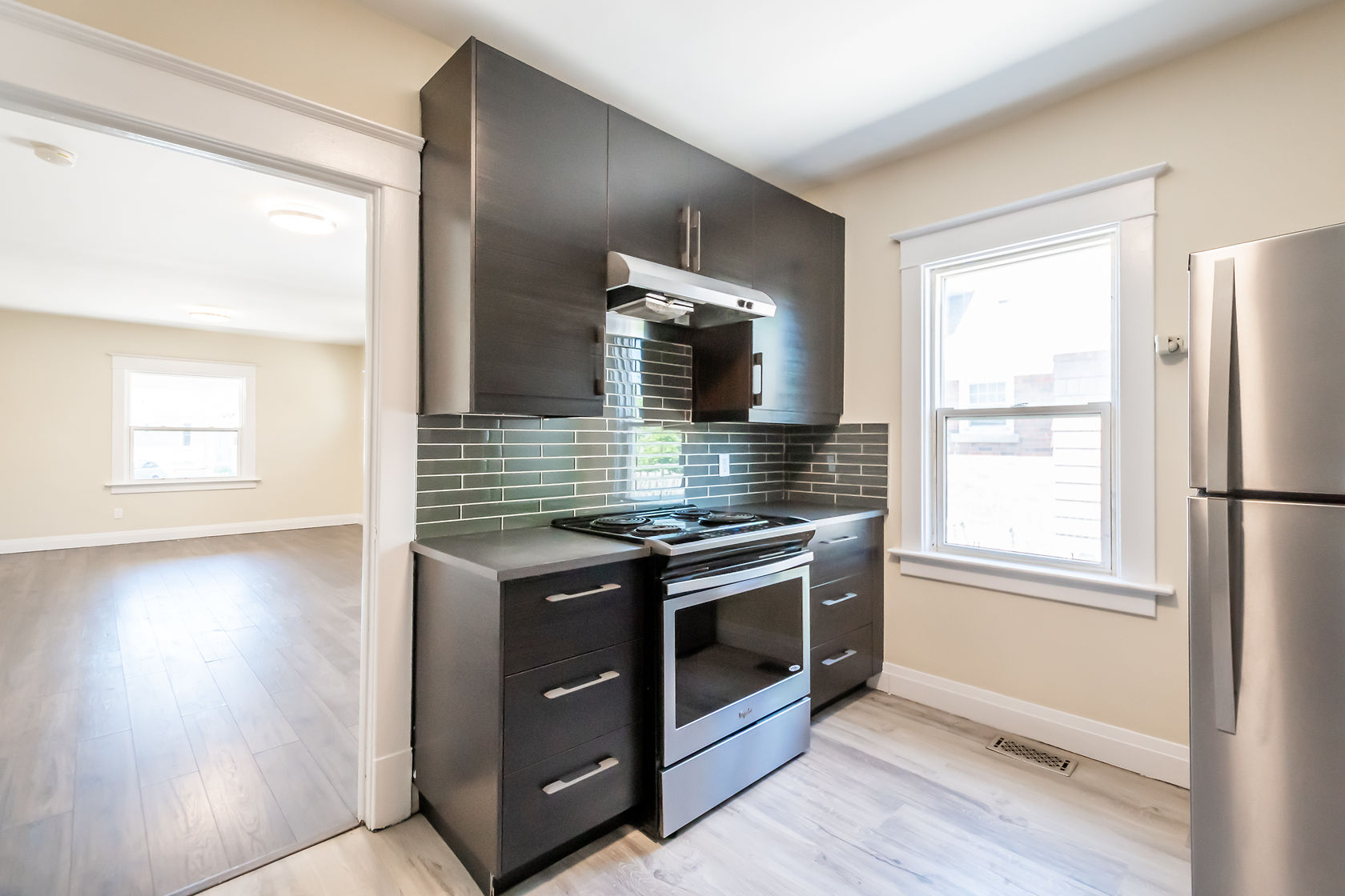 Clean finished kitchen with strong material contrast and excellent natural lighting — premium portfolio shot — Eastchester, Hamilton | MTC Renovations