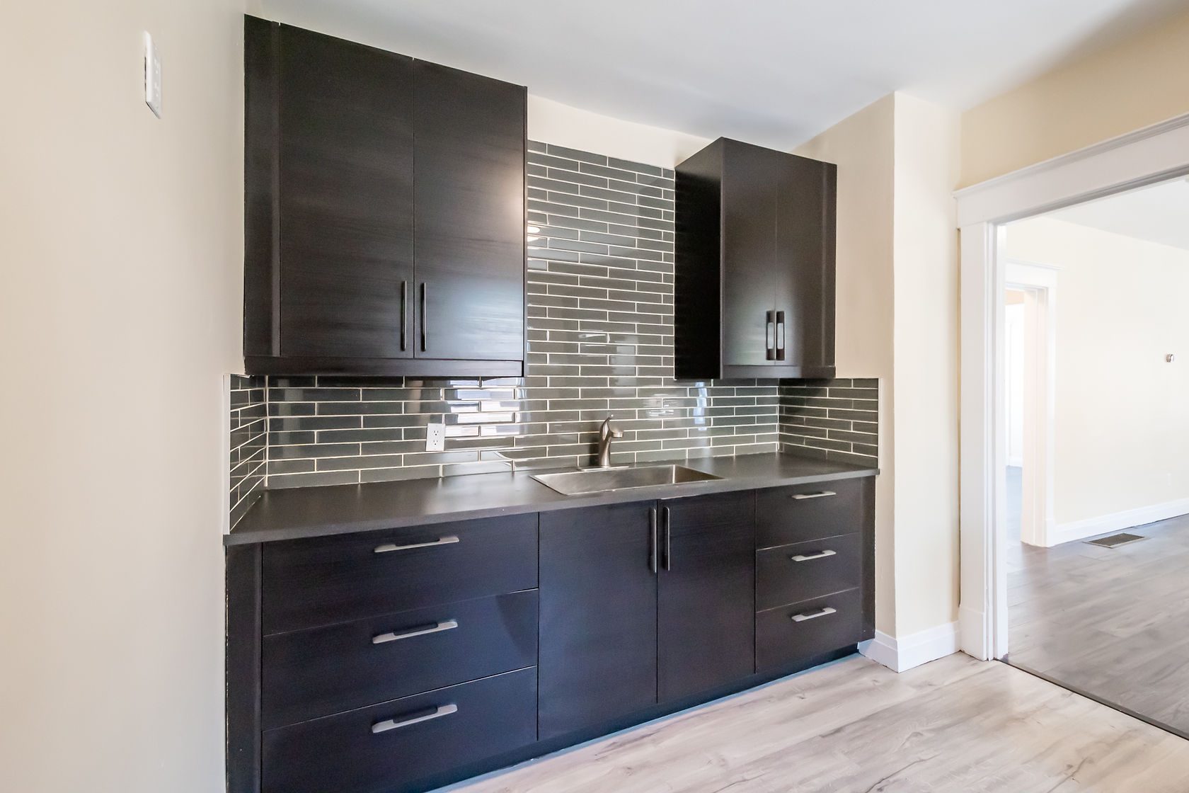 Professional finished kitchen with excellent natural light, clean staging, and strong material contrast — premium portfolio shot — Eastchester, Hamilton | MTC Renovations
