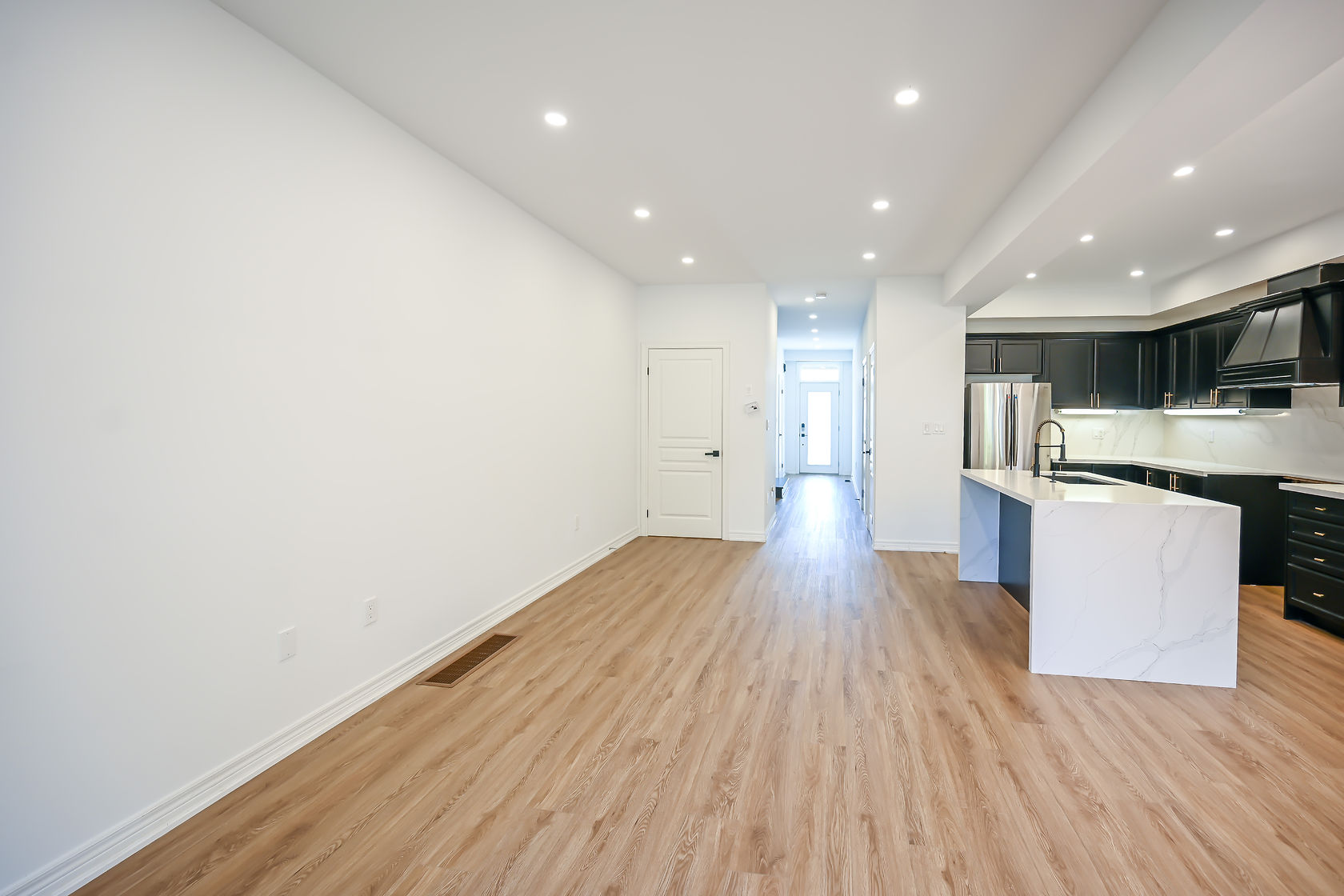 Bright open-concept space with fresh painted walls and excellent material contrast — Stonehenge, Hamilton | MTC Renovations