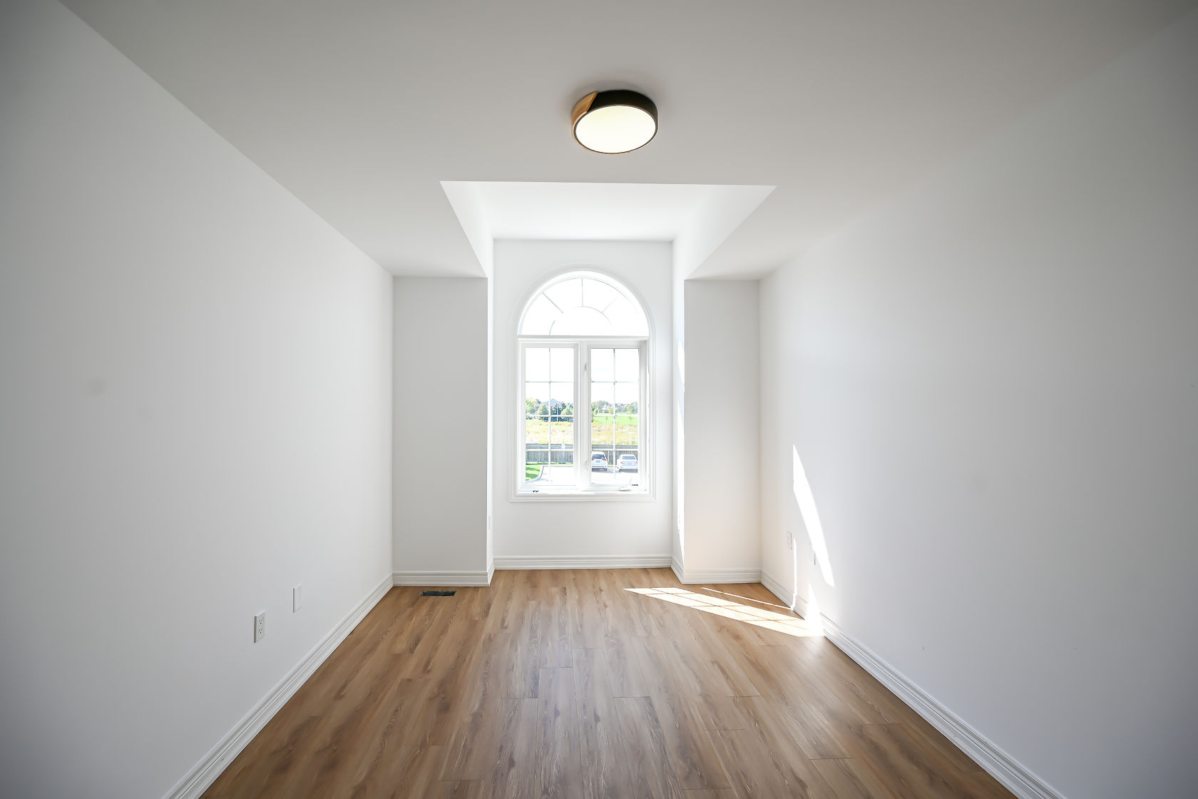 Bright bedroom with beautiful arched window feature and freshly painted walls — Stonehenge, Hamilton | MTC Renovations