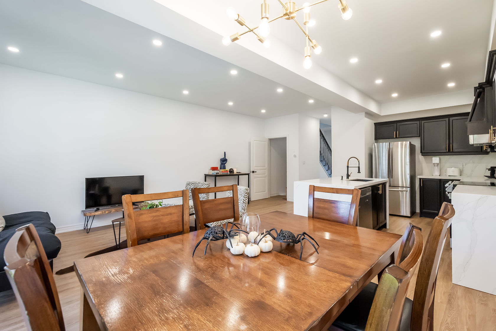 Professional wide-angle living room with excellent lighting and clean painted wall finishes — Stonehenge, Hamilton | MTC Renovations