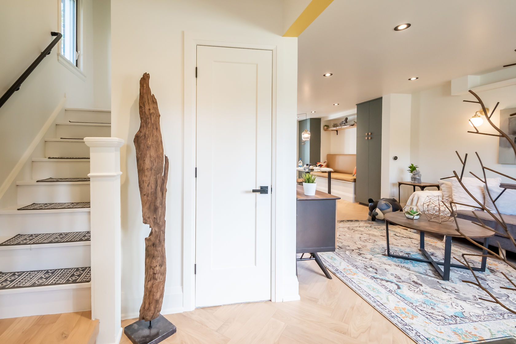Finished living space with modern staircase and fresh painted walls — Rosedene, Hamilton | MTC Renovations