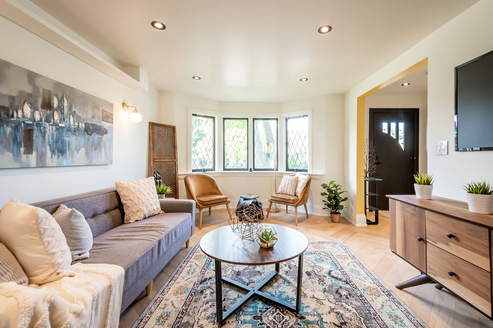 Bright finished living room with crisp painted walls and professional staging — Rosedene, Hamilton | MTC Renovations