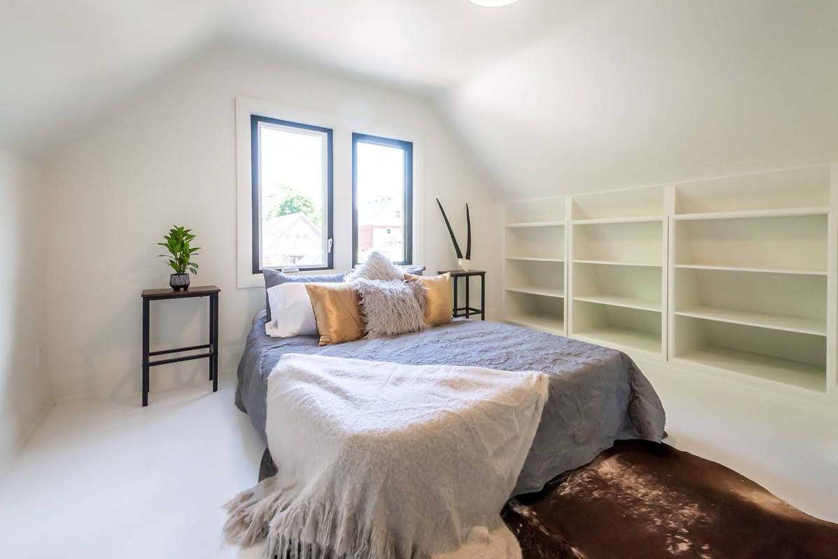 Bright staged bedroom with fresh painted walls and built-in storage — Rosedene, Hamilton | MTC Renovations